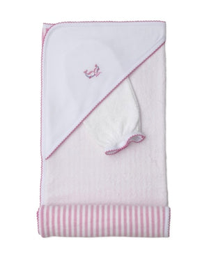 A white hooded baby towel—the Whale Pods Hooded Towel with Mitt by Kissy Kissy—crafted from soft Pima cotton, features delicate pink trim and an embroidered bird detail, folded on top of a pink and white striped blanket.