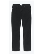 The Frame L’Homme Slim Denim jeans in black, featuring a mid-rise and slim fit, are displayed against a plain white background.