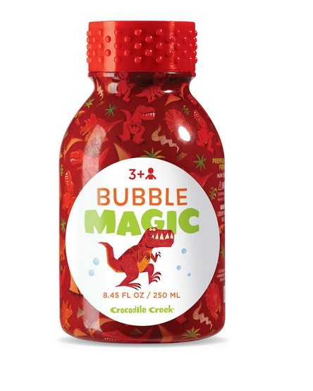 Crocodile Creek Bubble Magic—8.45 fl oz (250 mL) red bottle with dinosaur illustrations. Includes bubble wands for ages 3+; perfect for outdoor play.