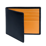 The Ettinger Bridle Billfold 6 Credit Card Wallet features black English bridle leather with an open flap, revealing multiple orange card slots inside and exemplifying the brand's traditional craftsmanship.