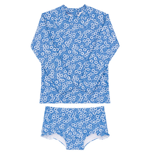 The Girls' Rosebay Rashguard Set by Minnow features a blue long-sleeve rash guard and matching bikini bottoms with a white floral pattern, providing excellent sun coverage.