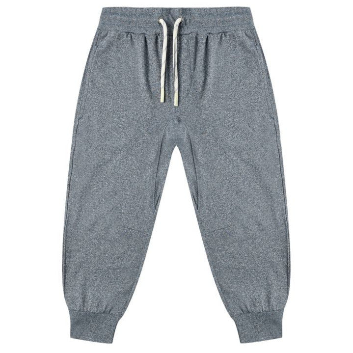 The Boys' Century Tech Jogger by Rylee & Cru features an elastic waistband, white drawstrings, side pockets, and ribbed cuffs for a relaxed fit. Versatile gray joggers shown laid flat on a white background.