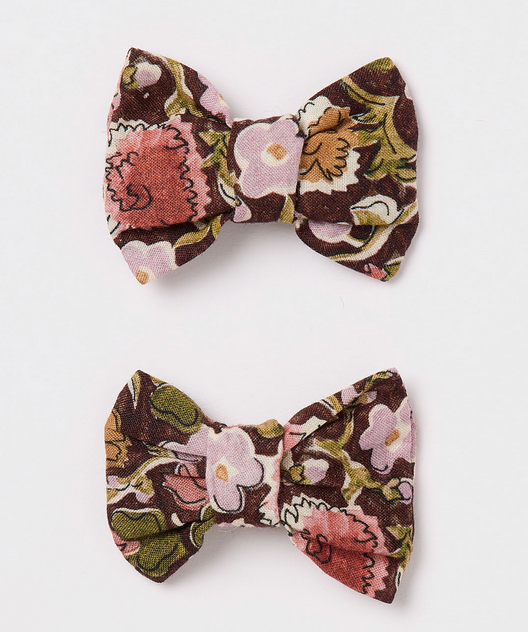Two fabric hair bows—Miniclic Barette by Bonpoint—feature a charming floral pattern in pink, brown, green, and cream. Crafted from Liberty Tana Lawn cotton and displayed on a white background, these elegant organic cotton accessories are perfect as stylish barrettes for any occasion.