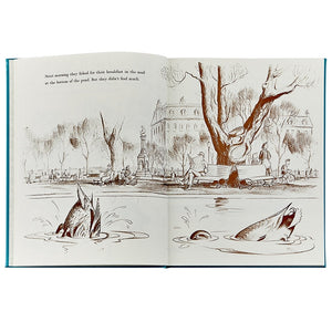 Illustration of fish tails poking out of a pond in a park setting, with trees and a building in the background. Nearby, elegantly rendered mallards from the "Make Way For Ducklings, Leather" collection by Graphic Image glide gracefully on the water’s surface.
