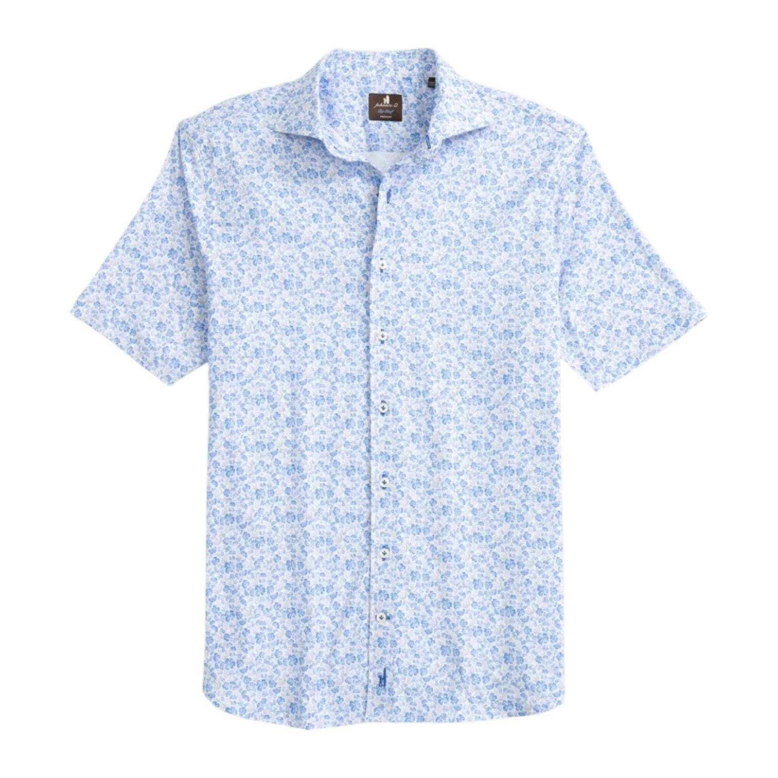 The Johnnie-O Filipe Shirt is a coastal-inspired short-sleeve button-up featuring a light blue floral pattern on a white background, complete with a smart button-down collar and shown laid flat on a white surface.