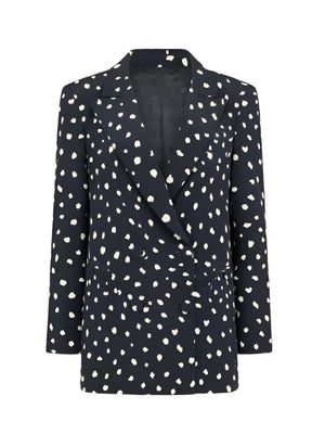 The Mariquita Everyday Blazer by Blaze Milano is a chic black blazer with white polka dots, a classic notched lapel, and long sleeves for timeless style.