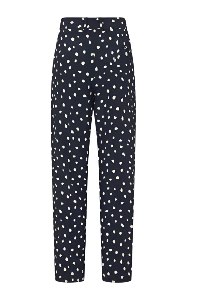 The Mariquita Nana Pants by Blaze Milano are navy blue, high-waisted, straight-leg trousers featuring a white irregular polka dot pattern and a front zipper closure.