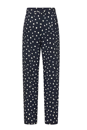 The Mariquita Nana Pants by Blaze Milano are navy blue, high-waisted, straight-leg trousers featuring a white irregular polka dot pattern and a front zipper closure.