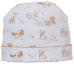 The Kissy Kissy Puppy Paws Printed Hat is crafted from soft Pima cotton and features light brown and tan cartoon dog illustrations with small puppy paw prints, finished with a neatly stitched hem around the base.