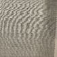 A close-up of a light grey, textured fabric swatch with a zigzag edge—ideal for crafting Samuelsohn's Slim Fit Flat Front Wool Pants, designed for a sleek look with an unfinished hem.