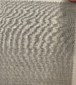 A close-up of a light grey, textured fabric swatch with a zigzag edge—ideal for crafting Samuelsohn's Slim Fit Flat Front Wool Pants, designed for a sleek look with an unfinished hem.