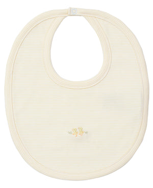 The Kissy Kissy Premier Baby Duckling Striped Bib features cream Pima cotton with subtle stripes and two hand-embroidered yellow ducklings near the bottom center.