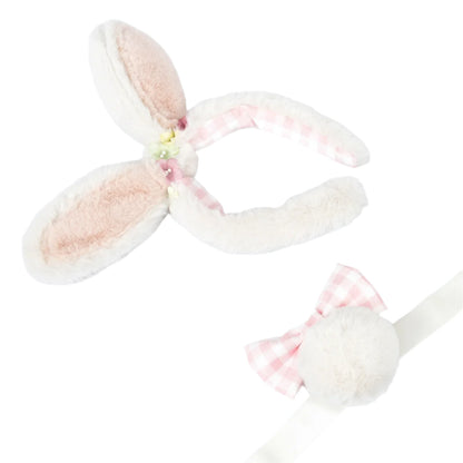 The Meri Meri Plush Bunny Ears & Tail Set includes a fluffy headband with cute bunny ears, a pink bow, and a white pom-pom on a ribbon.