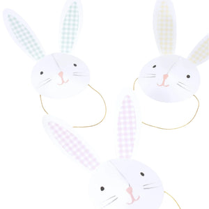 Meri Meri's Bunny Party Hats feature three paper masks with pastel gingham plaid ears and attached strings, creating a charming fascinator style on a white background.