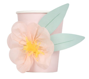 A pink Meri Meri Party Cup decorated with a light pink paper flower and two green paper leaves makes the perfect party favor for any children's party.