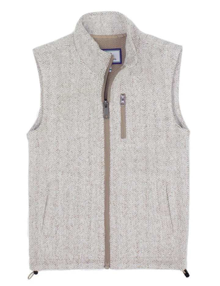 The Properly Tied Boys' Upland Vest features a light grey herringbone pattern, zip-up front, high collar, sleeveless cut, and a vertical zippered chest pocket.