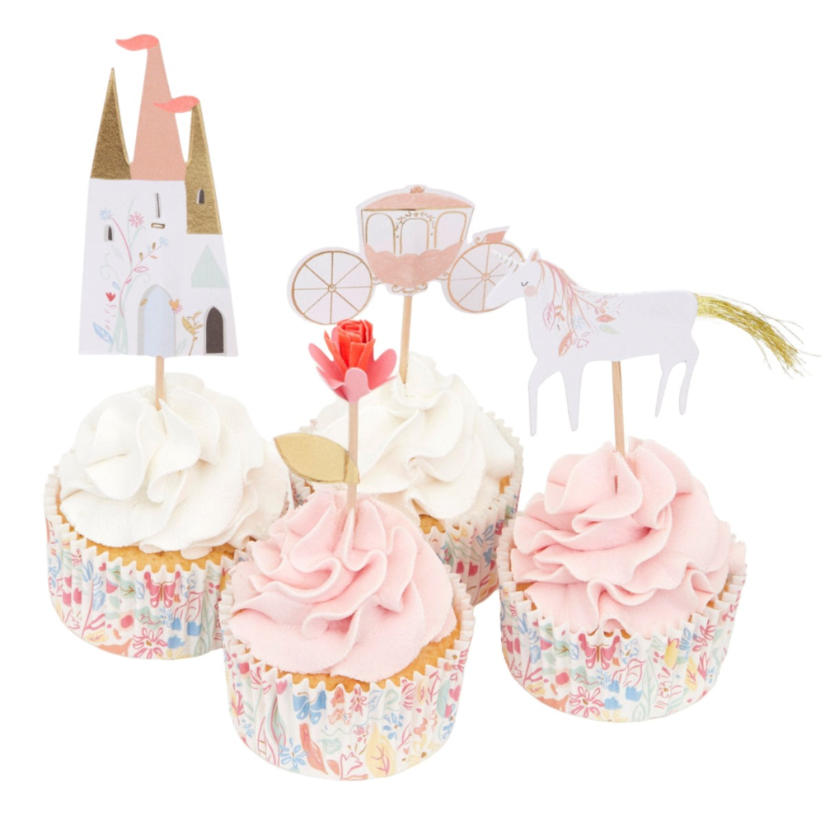 The Meri Meri Cupcake Kits by Meri Meri include four delightful celebration cupcakes adorned with pink and white frosting, each topped with paper toppers showcasing a castle, carriage, horse, and rose. The cupcakes are encased in wrappers featuring a charming floral pattern.