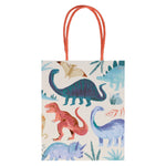 A Meri Meri Party Bag featuring fun illustrations of various dinosaurs in different colors, like a green long-necked dinosaur, a red T-Rex, and a blue triceratops. The bag has two twisted paper handles, perfect for party bags.