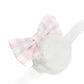 The Meri Meri Plush Bunny Ears & Tail Set features a fluffy white pom-pom headband adorned with a pink and white gingham bow, all set against a plain white background.