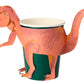 A Meri Meri Party Cup, perfect for children's party favors, features a pink and orange paper dinosaur wrapped around it, using the cup as the body of the dinosaur.