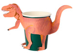 A Meri Meri Party Cup, perfect for children's party favors, features a pink and orange paper dinosaur wrapped around it, using the cup as the body of the dinosaur.