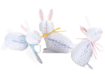 Three Bunny Honeycomb Decorations by Meri Meri, featuring white bunnies with pastel bows in blue, yellow, and pink, make charming 3D Easter table settings.