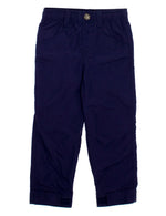 A pair of Boys' Mallard Pant by Properly Tied in navy blue, featuring an elastic waistband, side pockets, button closure, and folded cuffs. These lightweight children's pants are laid flat on a white background.