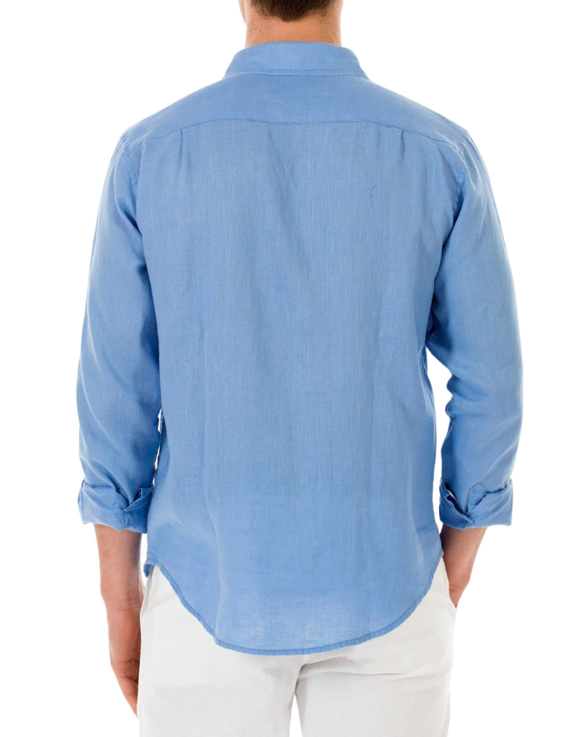 A person wearing a European fit, light blue, long-sleeved Pink House Mustique Men's Plain Linen Shirt and white pants is standing with their back to the camera.