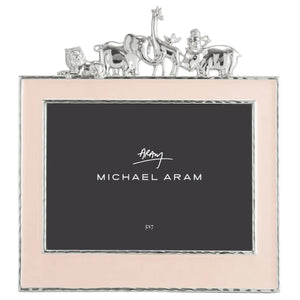 The Michael Aram Animals Nickelplate Frame, 5x7 in pink, features a silver giraffe, elephant, lion, and monkey along the top—an adorable way to showcase joyful children’s memories.