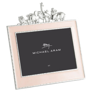 The Michael Aram Animals Nickelplate Frame, 5x7 in pink, features a silver finish with metal animal figures—lion, elephant, giraffe, and rhinoceros—making it perfect for displaying cherished children’s memories.