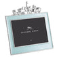 The Michael Aram Animals Nickelplate Frame, 5 x 7 – Blue, features a silver design with a light blue border and small animal figurines—lion, elephant, giraffe, and rhinoceros—perfect for displaying children's memories or enhancing any collection.