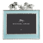 The Michael Aram Elephant Frame 4X6 - Blue features a light blue border, silver trim, and two silver elephants facing each other—an enchanting way to display children's cherished memories.