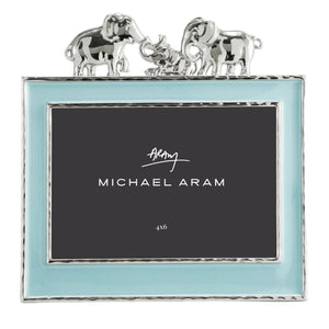 The Michael Aram Elephant Frame 4X6 - Blue features a light blue border, silver trim, and two silver elephants facing each other—an enchanting way to display children's cherished memories.