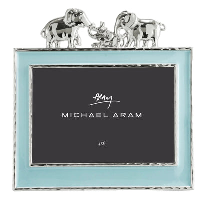 The Michael Aram Elephant Frame 4X6 - Blue features a light blue border, silver trim, and two silver elephants facing each other—an enchanting way to display children's cherished memories.