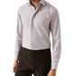 A man wears the Eton Slim Cut Away Micro Check Twill Shirt in light-colored, wrinkle-resistant organic cotton with a subtle micro check pattern and dark trousers, standing against a plain white background.