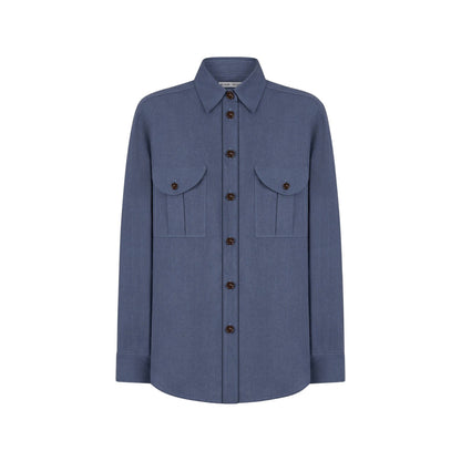The Midday Sun Berber Shirt by Blaze Milano is a long-sleeved blue cotton shirt with a collar and two front chest pockets, shown against a plain white background.