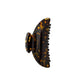 The Machete Midi Heirloom Claw, shown on a white background, is crafted from premium Italian acetate in a brown tortoiseshell pattern and features curved edges with double-walled interlocking teeth.
