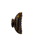 The Machete Midi Heirloom Claw, shown on a white background, is crafted from premium Italian acetate in a brown tortoiseshell pattern and features curved edges with double-walled interlocking teeth.