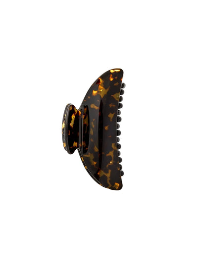 The Machete Midi Heirloom Claw, shown on a white background, is crafted from premium Italian acetate in a brown tortoiseshell pattern and features curved edges with double-walled interlocking teeth.