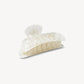 The Midi Heirloom Claw by Machete is a large, ivory-colored hair clip made from Italian acetate with a glossy, marble-like finish and double-walled construction, shown on a plain white background.