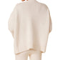 Person wearing a light-colored, oversized Sablyn Mimi Crewneck Sweater and matching soft cashmere pants, seen from the back.