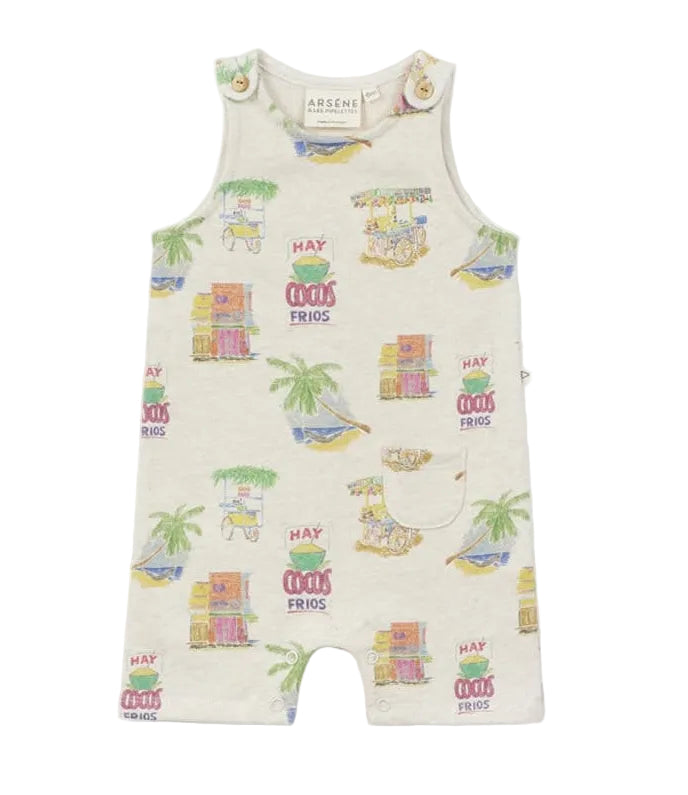The Baby Mini Coco Jumpsuit by Arsene & Les Pipelettes is a sleeveless romper made from cozy, organic cotton and features a vibrant tropical print with palm trees, boats, fruit stands, and the phrase "Hay cocos frios" on a cream background. Designed with a front pocket and buttoned shoulders for easy changing, this organic cotton jumpsuit keeps your little one comfortable and stylish all day long.