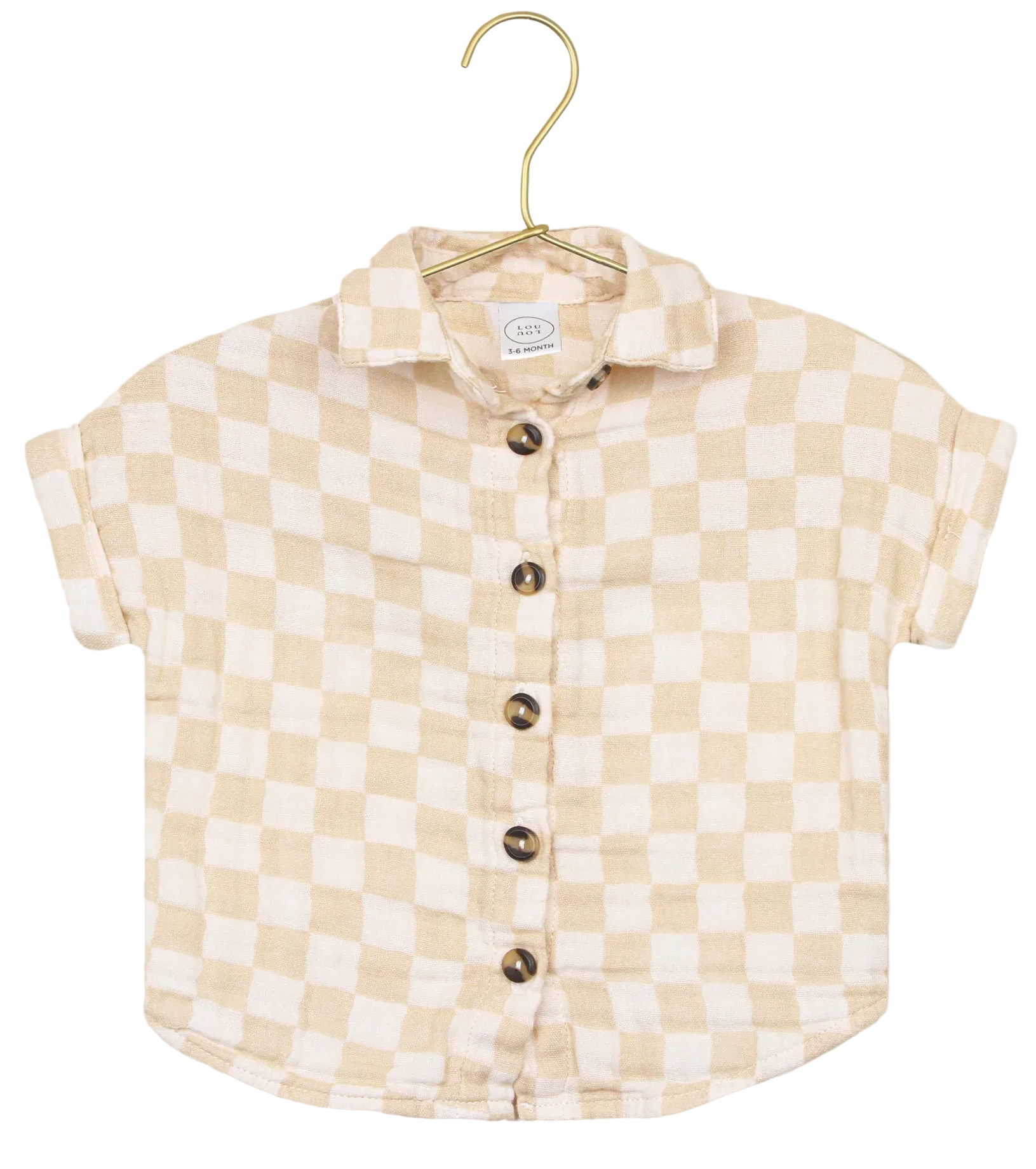 The Lou Lou & Company Baby Boys’ Cloud Muslin Shirt, featuring a beige and white checkered design with short sleeves and button-up front, hangs on a gold hanger against a white background—a versatile piece with a relaxed fit, ideal for casual days.