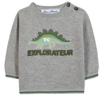 The Tartine et Chocolat Baby Boys’ and Toddler Knitted Sweater is crafted from 100% cotton in gray and features a playful green dinosaur graphic with the phrase “TC EXPLORATEUR” on the front, two buttons on the left shoulder, and green trim on the cuffs and hem.