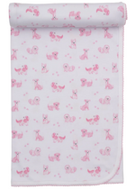 The Kissy Kissy Puppy Paws Printed Blanket features an ultra-soft white Pima cotton design adorned with a charming repeating pattern of pink puppies in various poses and tiny pink puppy paws, finished with scalloped edging and rolled at one end—an ideal choice for those seeking an exceptionally cozy baby blanket.