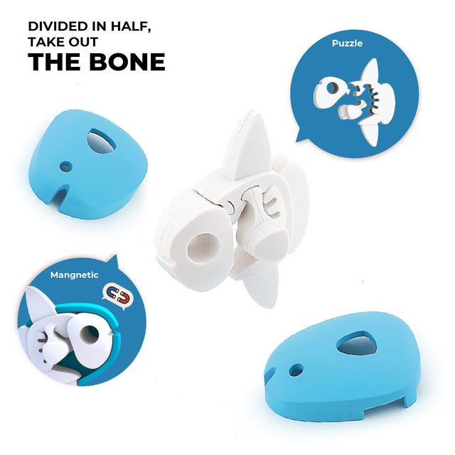 Image of a white plastic dog-shaped toy with a magnetic bone inside, shown in various stages of assembly and disassembly with blue plastic parts. Text reads: "Divided in half, take out the bone." From the Halftoys Ocean Friends collection by Halftoys, it's an engaging animal puzzle for all ages.