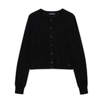 The Moni Crop Cardigan by Anine Bing is a black, long-sleeved wool-cashmere knit with a round neckline and cropped hem—an essential addition to any capsule wardrobe. Laid flat on a white background.