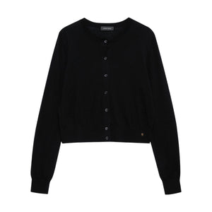 The Moni Crop Cardigan by Anine Bing is a black, long-sleeved wool-cashmere knit with a round neckline and cropped hem—an essential addition to any capsule wardrobe. Laid flat on a white background.