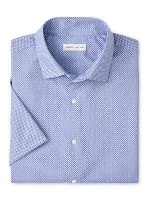 The Patton Performance Poplin Sport Shirt by Peter Millar is a light blue patterned button-up with a classic collar, crafted from performance fabric and featuring the brand's label on the inside neck.