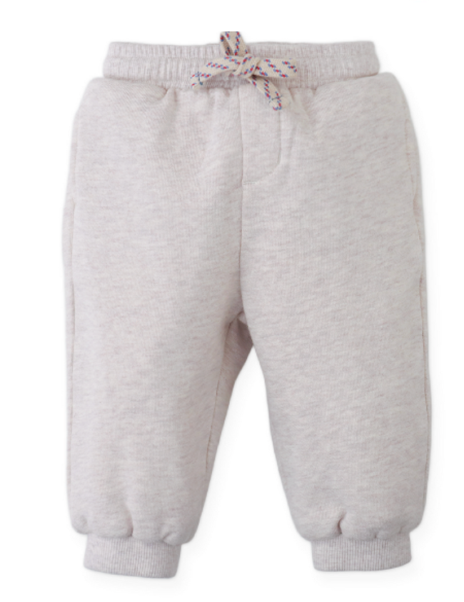 The Gingersnaps Baby Boys’ Alessio French Terry Jogger Pants in light beige are crafted from soft French terry and feature an elastic waistband, decorative drawstring, and cuffed ankles, shown against a white background.